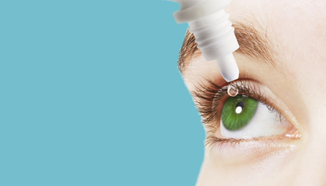 Dry eye drops being applied directly to the eye